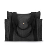 Sac cabas en toile gris anthracite, vue frontale, avec anses noires et bouton pression doré