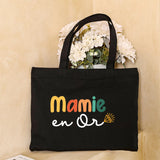 Sac fourre-tout en toile noire avec le message 'Cette Mamie appartient à' avec des cœurs