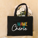 Sac fourre-tout en toile noire avec le message 'Mamie Chérie de' et des cœurs marron